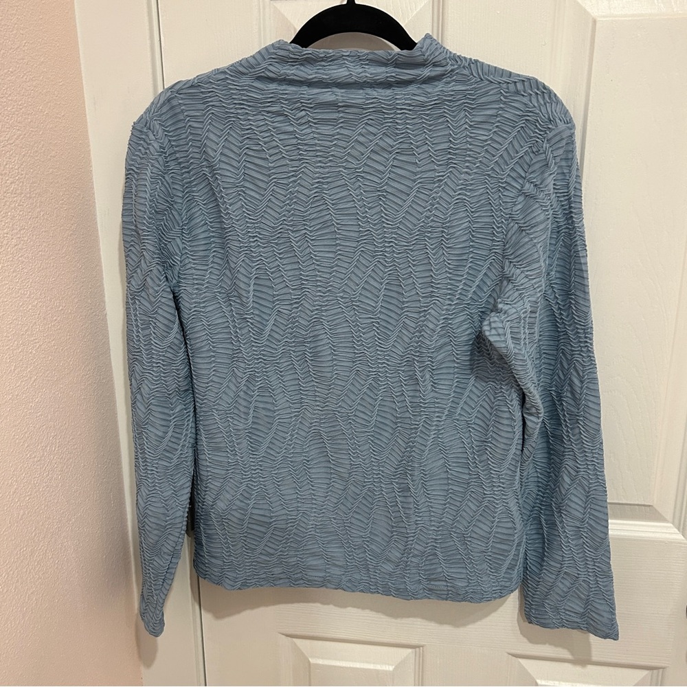 Blue mock neck long sleeve textured blouse